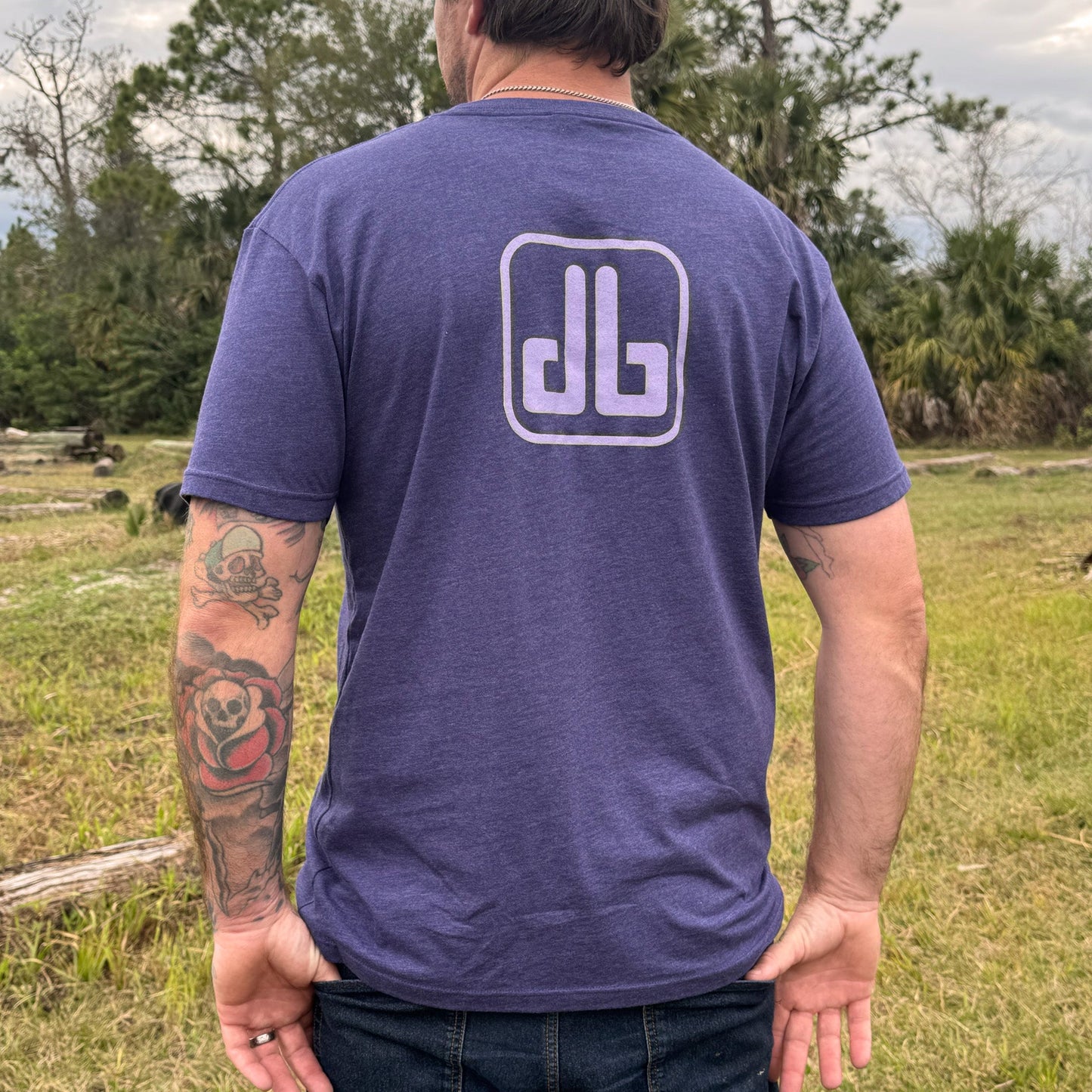 Purple eDirtyBike short sleeve T-shirt displayed from the back, featuring a casual fit and brand logo on the upper back.