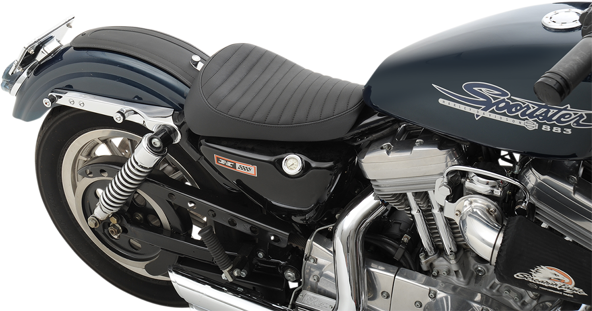 Drag Specialties solo seat for Harley-Davidson XL '82-'03, classic style, black leather, and contoured design for comfortable riding.