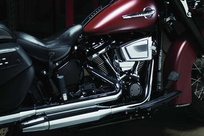 Black Kuryakyn Precision Oil Line Cover for Harley Davidson 2018 models, showcasing a sleek protective accessory for motorcycle engine oil lines.