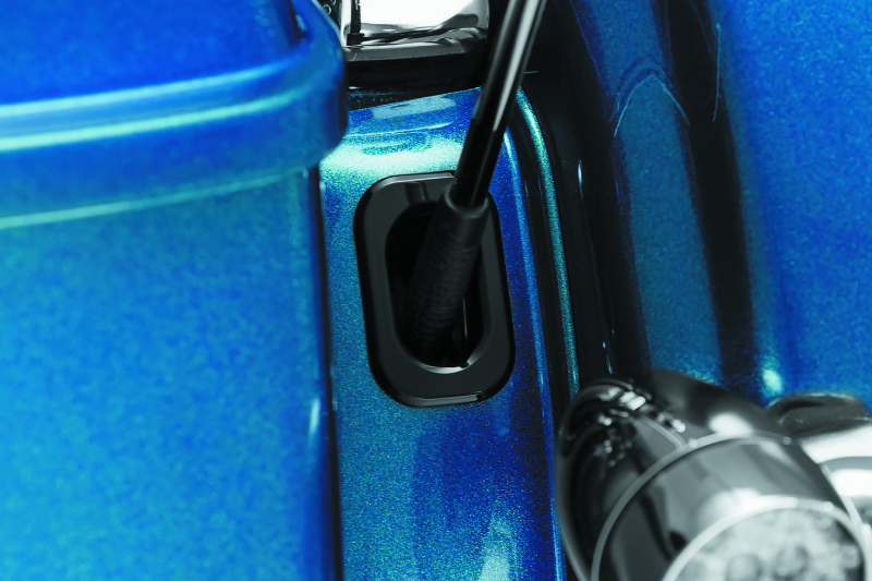 Kuryakyn antenna hole accent for Harley Davidson Street Glide and Road Glide motorcycles, featuring chrome finish and stylish design.