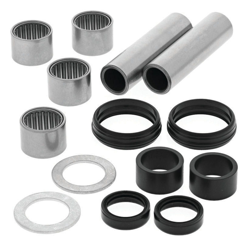 QuadBoss Yamaha YFZ450 swingarm repair kit with metal components and replacement parts for motorcycle suspension maintenance.