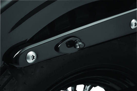 Kuryakyn Fender Strut Cover Plates for Harley-Davidson motorcycles, designed to enhance the rear fender appearance.
