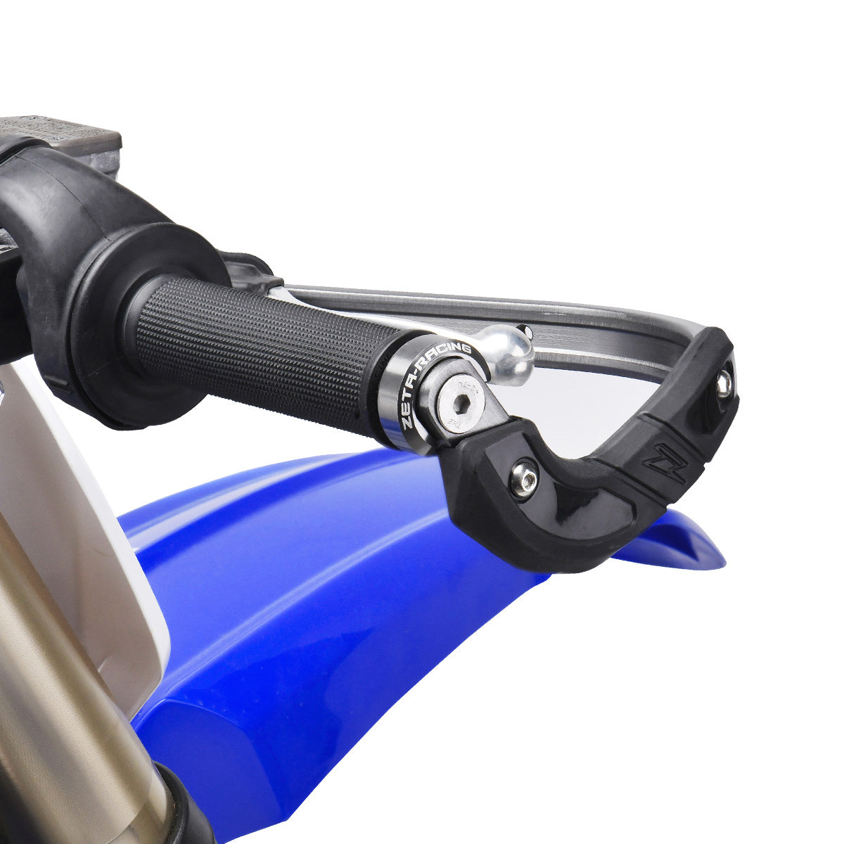 ZETA Armor Ti color handguard bar end plugs attached to motorcycle handlebars, showcasing durable, lightweight titanium design.