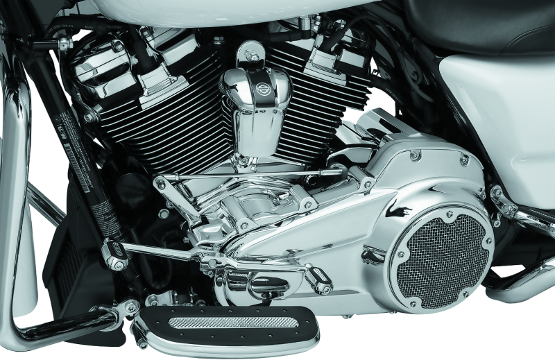 Kuryakyn chrome inner primary cover for Harley Davidson Touring models, showcasing polished finish and detailed design.