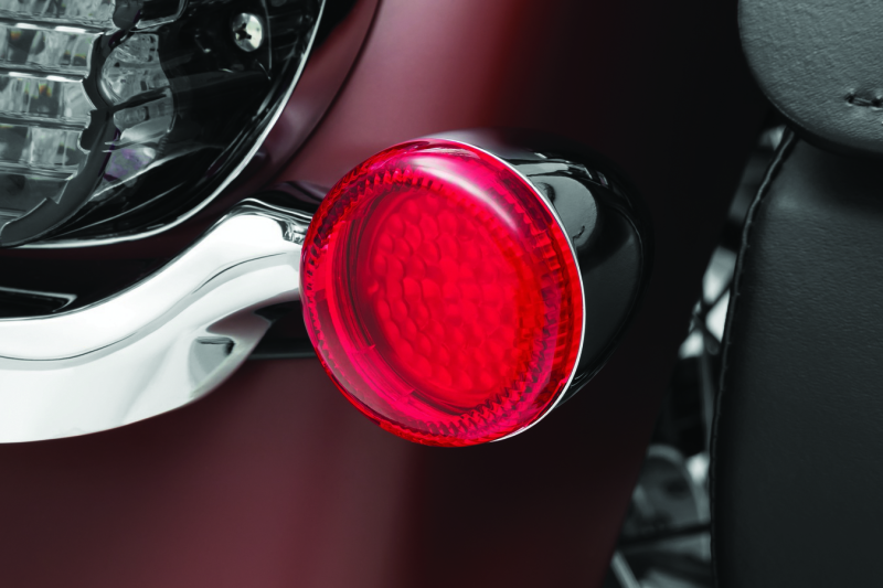 Kuryakyn Luminez LED rear turn signal insert 1156 Red for Harley-Davidson motorcycle, showing the bright red LED lights in the image.