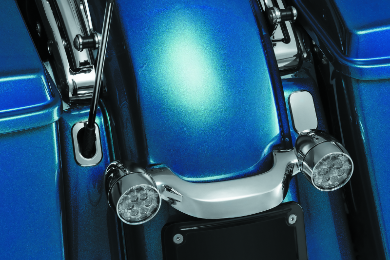 Chrome Kuryakyn antenna hole filler for Harley Davidson Touring models, custom fit, designed to enhance bike's appearance.