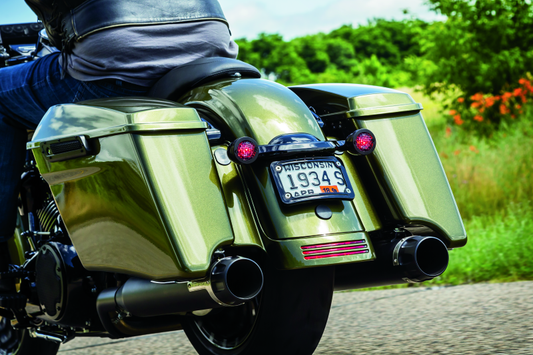 Kuryakyn curved license plate mount for Harley-Davidson Street Glide and Road Glide, part #3147, shown on a motorcycle.