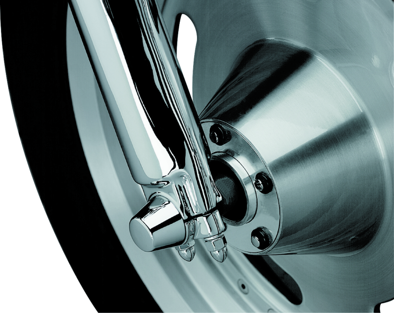 Kuryakyn chrome front axle nut caps for Harley Davidson Touring models, designed to enhance bike's appearance.