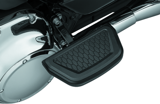 Black Kuryakyn Hex Passenger Board Inserts for Harley Davidson Touring Models, part #5903, shown on motorcycle passenger footboards.