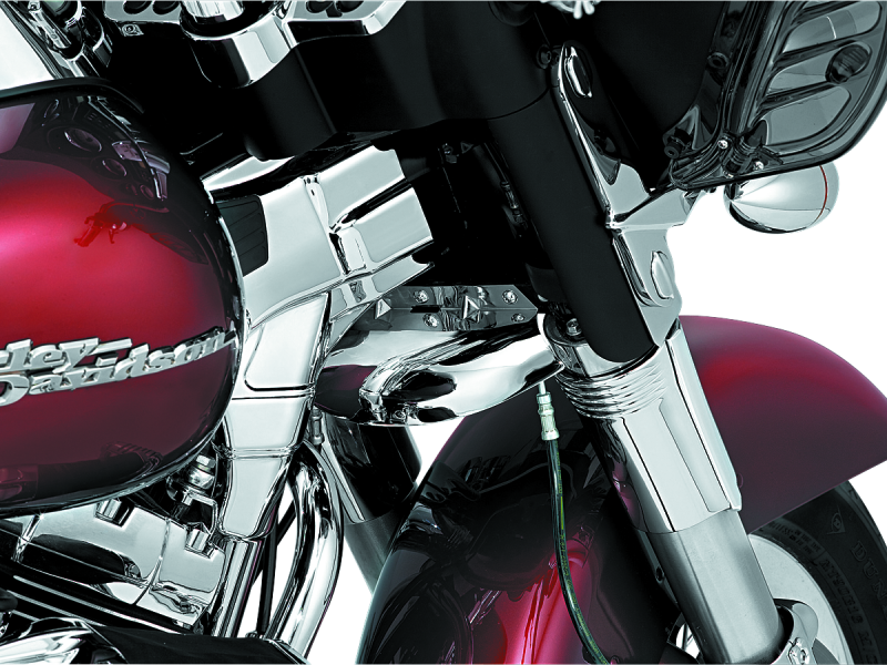 Kuryakyn lower tree wind deflector in chrome mounted on Harley-Davidson touring motorcycle, designed to reduce wind turbulence.