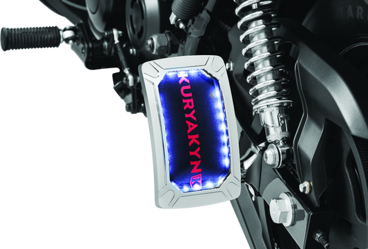 Kuryakyn Nova curved vertical mount chrome license plate holder with wraparound LED lighting and no visible fasteners.