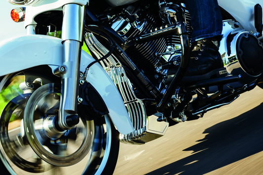 Chrome Kuryakyn oil cooler cover for Harley Davidson Touring models, featuring a sleek design and durable finish.