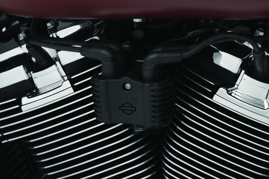 Chrome Kuryakyn Precision Coil Cover for Harley-Davidson Softail models, part #6466, shown on a motorcycle engine.
