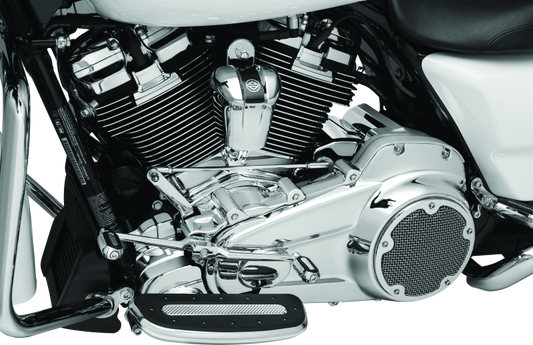 Chrome Kuryakyn Precision Lower Frame Cover for Harley Davidson Touring models, shiny and detailed on the motorcycle frame.