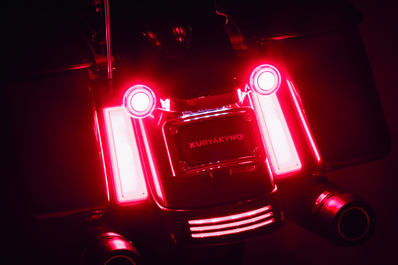 Kuryakyn Tracer Filler Panel Lights with red lens, custom LED accent for motorcycle saddlebags, enhancing style and visibility.