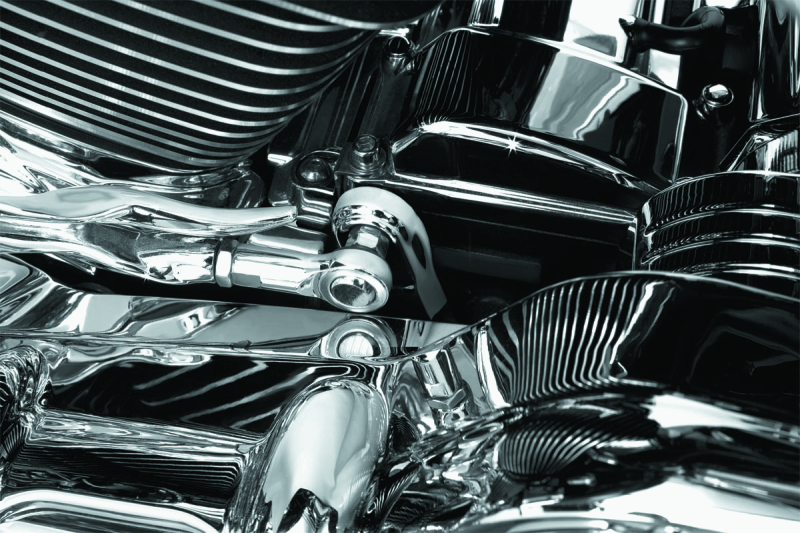 Chrome transmission shift arm cover by Kuryakyn for Harley Davidson Touring models, showing detailed chrome finish on the shift arm.