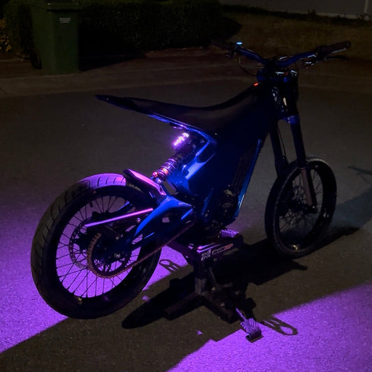 Project9 Talaria XXX HyperGlow front and rear bicycle lighting kit with purple glowing effect and durable components.