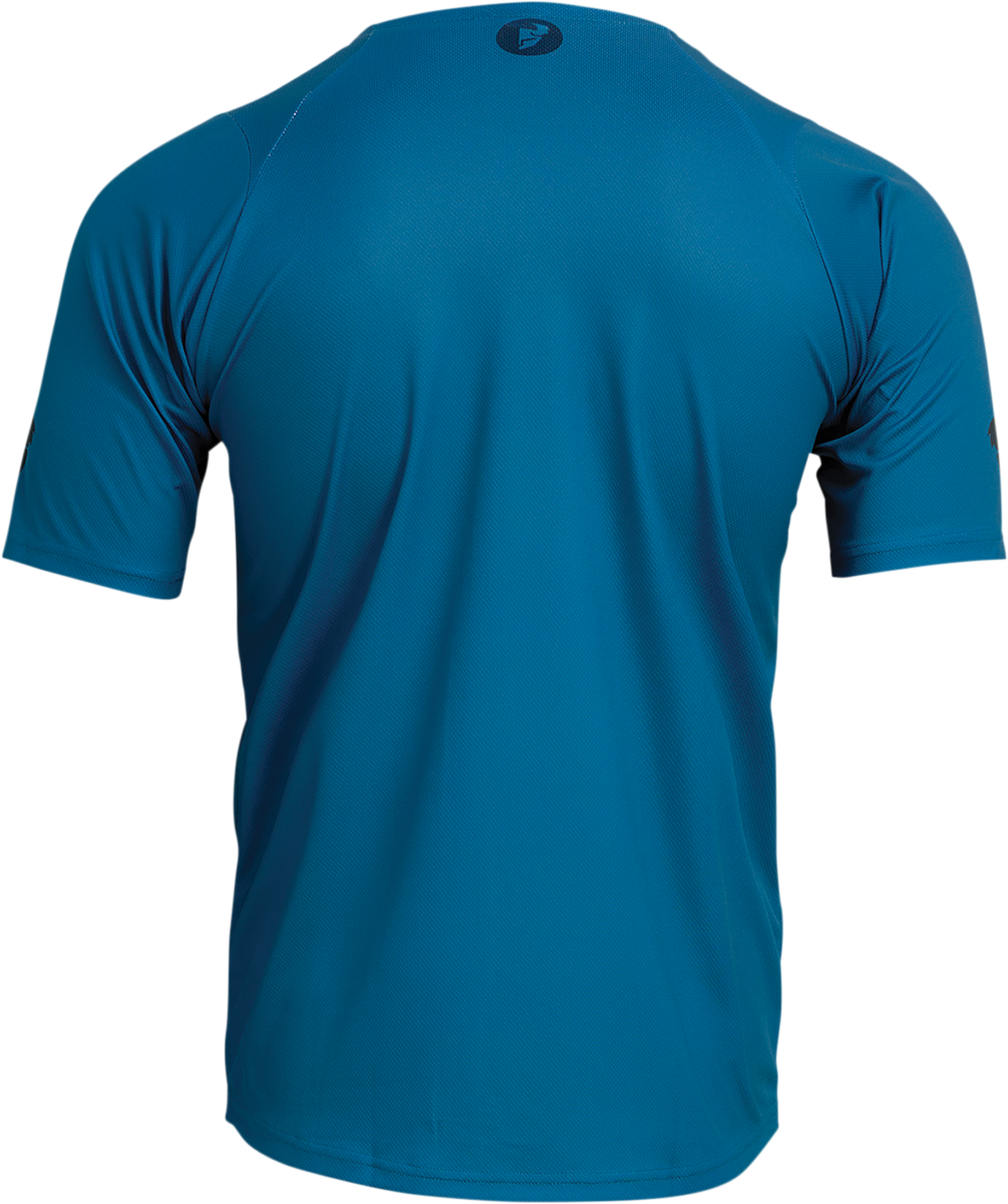 THOR Assist Caliber short-sleeve jersey in teal, medium size, featuring breathable fabric and racing-inspired design.