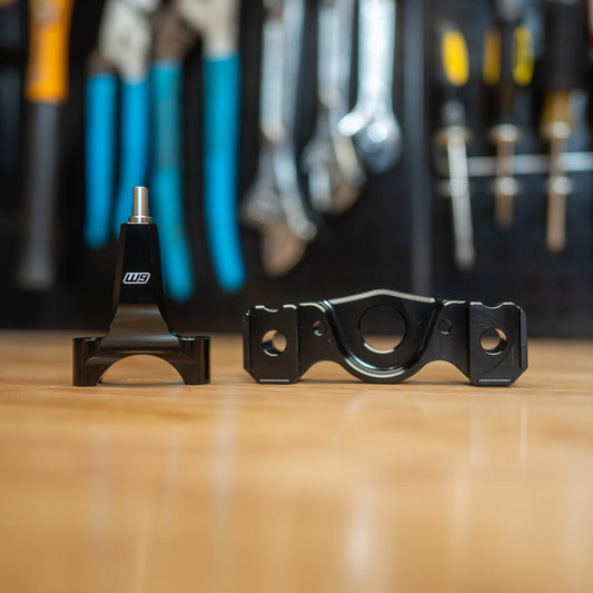 Warp9Racing Surron Ultra Bee Stabilizer Mount with Frame Post, black metal bike accessory attached to electric motorcycle frame.