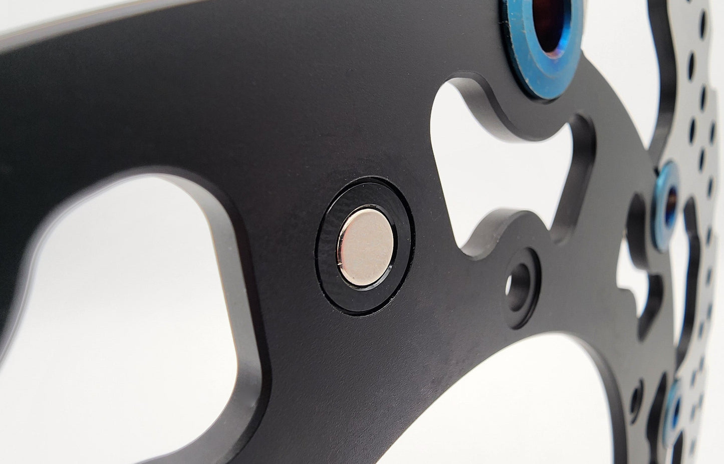 Warp9Racing KTM Rotor Speedo Magnet V3 for speedometer, orange magnetic component designed for KTM motorcycles.