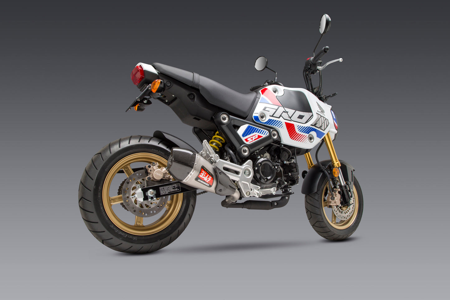 Yoshimura RS-9T Street Series motorcycle exhaust system in black with chrome finish, featuring Yoshimura branding and polished tips.