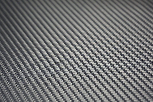 Saddlemens Carbon Seat Cover in black, measuring 54x36 inches, designed for motorcycle seats, with textured carbon fiber pattern.