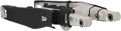 A black Acerbis Swing Arm Guard mounted on a motorcycle body, designed to protect the swing arm from debris and damage.
