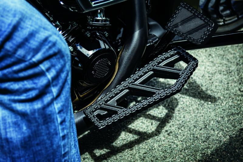 Kuryakyn Riot brake pedal pad for Harley Davidson FL models, durable aluminum with serrated traction surface.