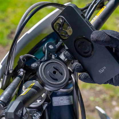 Bill's Exhausts SP CONNECT Anti-Vibration Module SPC+ for phone charging, shown attached to a device with a sleek design.