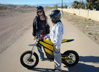 Heybike Villain electric dirt bike with mid-drive motor, 45 MPH top speed, and 50-mile range, shown on rugged off-road terrain.