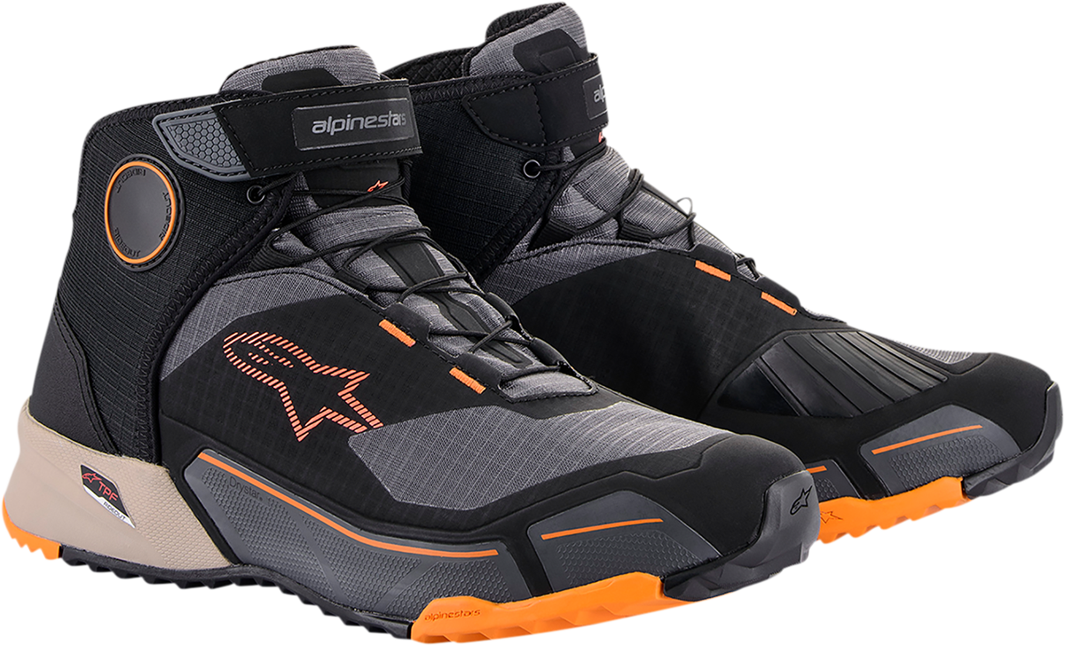 Alpinestars CR-X Drystar motorcycle shoes in black, brown, and orange with sturdy design and textured sole.
