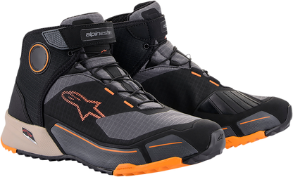 Alpinestars CR-X Drystar motorcycle shoes in black, brown, and orange with sturdy design and textured sole.