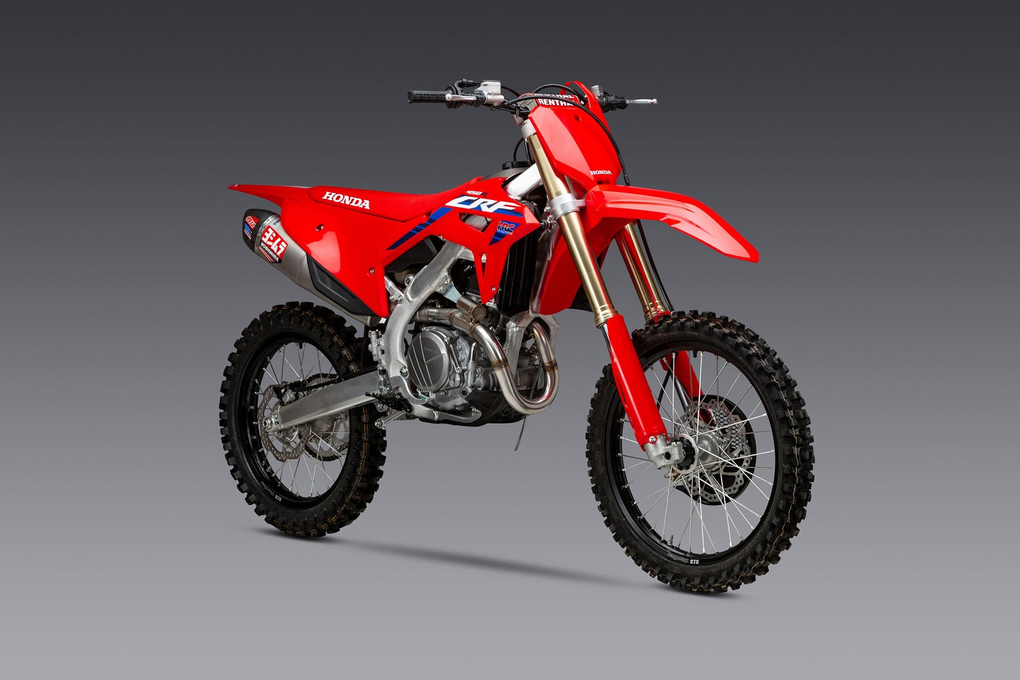 YOSHIMURA RS-12 exhaust system with matte carbon fiber end cap installed on Honda CRF450 dirt bike.