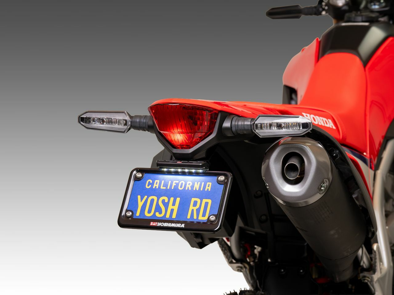YOSHIMURA Yoshimura V2 Fender Eliminator Kit for Honda motorcycle, showing the sleek black design and mounting hardware.