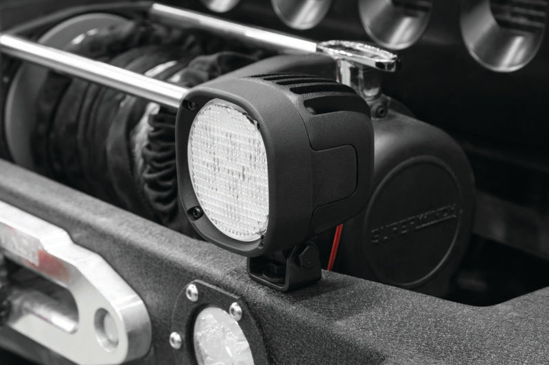 Kuryakyn Lodestar 1850L high-output driving lights installed on a powersports vehicle, showcasing bright LED illumination.