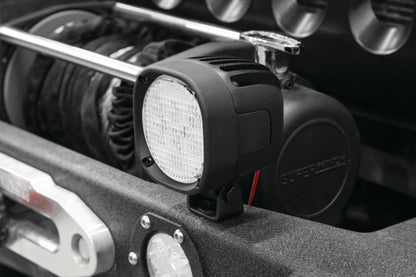 Kuryakyn Lodestar 1850L high-output driving lights installed on a powersports vehicle, showcasing bright LED illumination.