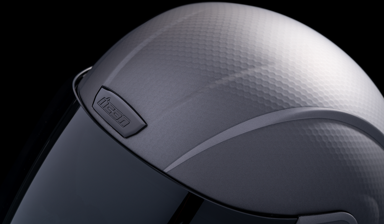 Silver ICON Airform™ Helmet with MIPS® technology in medium size, featuring a sleek design and adjustable straps.