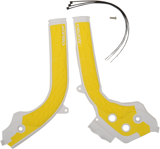 A close-up of Acerbis X-Grip motorcycle frame guards in white and yellow, designed for protection and durability.