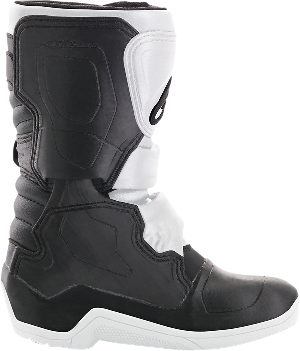 Alpinestars Youth Tech 3S motocross boots in black and white, showing the sturdy design and branding details.