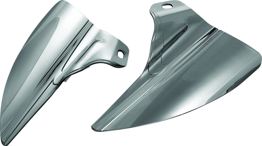 Kuryakyn Saddle Shields heat deflectors installed on Harley Davidson Touring motorcycle, showing shiny metal covers over the seat area.