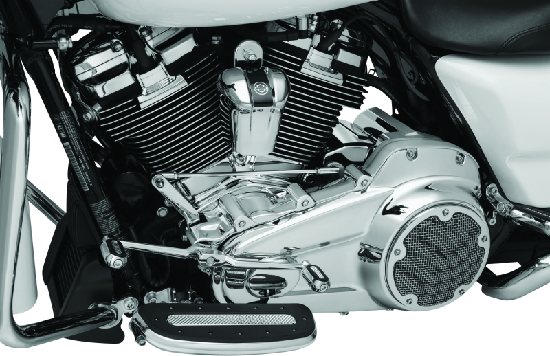 Kuryakyn Chrome Cylinder Base Cover Part 6411 on a Harley Davidson Touring motorcycle engine for a sleek, polished look.