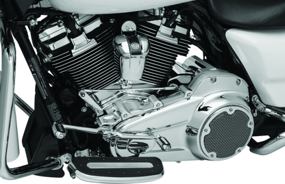 Kuryakyn Chrome Cylinder Base Cover Part 6411 on a Harley Davidson Touring motorcycle engine for a sleek, polished look.