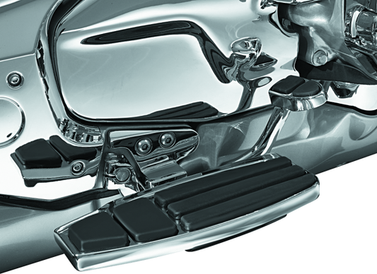 Kuryakyn driver floorboard kit in chrome for Honda Gold Wing GL1800 motorcycle, showing the detailed footrest and mounting hardware.