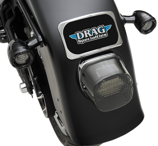 Chrome 3-hole license plate mount for fenders up to 8 inches wide, designed by DRAG SPECIALTIES, shown on a motorcycle.