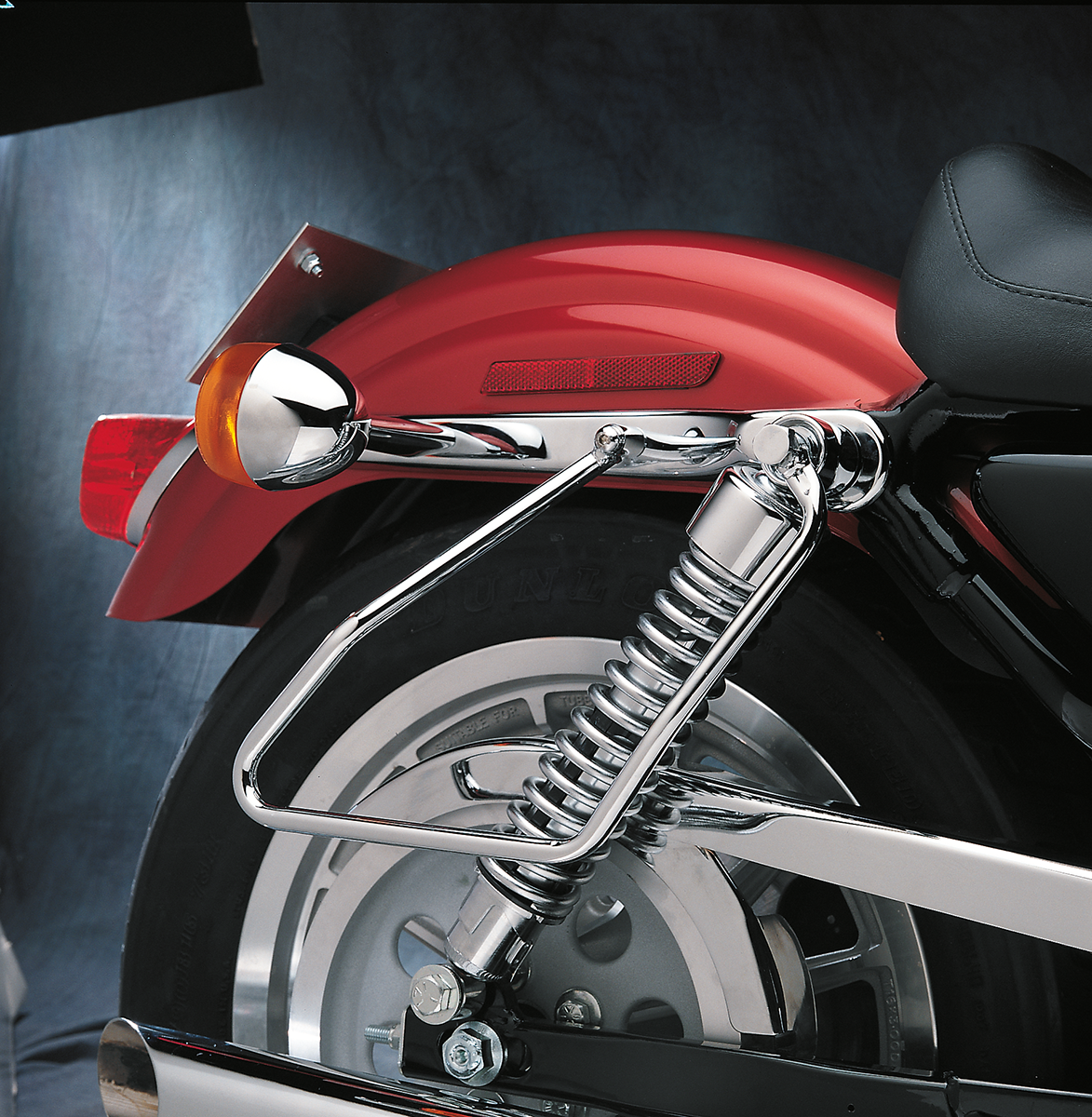 Drag Specialties saddlebag support for Harley XL 1994-2003, black metal mounting bracket for secure saddlebag attachment.