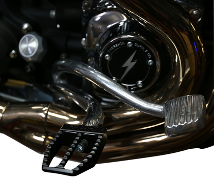 Black Militant foot pegs from THRASHIN SUPPLY CO. designed for Dyna motorcycles, featuring a sturdy, rugged construction.