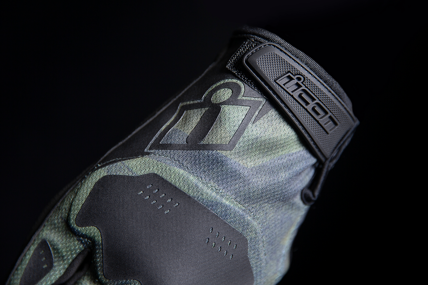 Open box green ICON Hooligan™ Battlescar motorcycle gloves by Bill's Exhausts, medium size, with rugged design and protective features.