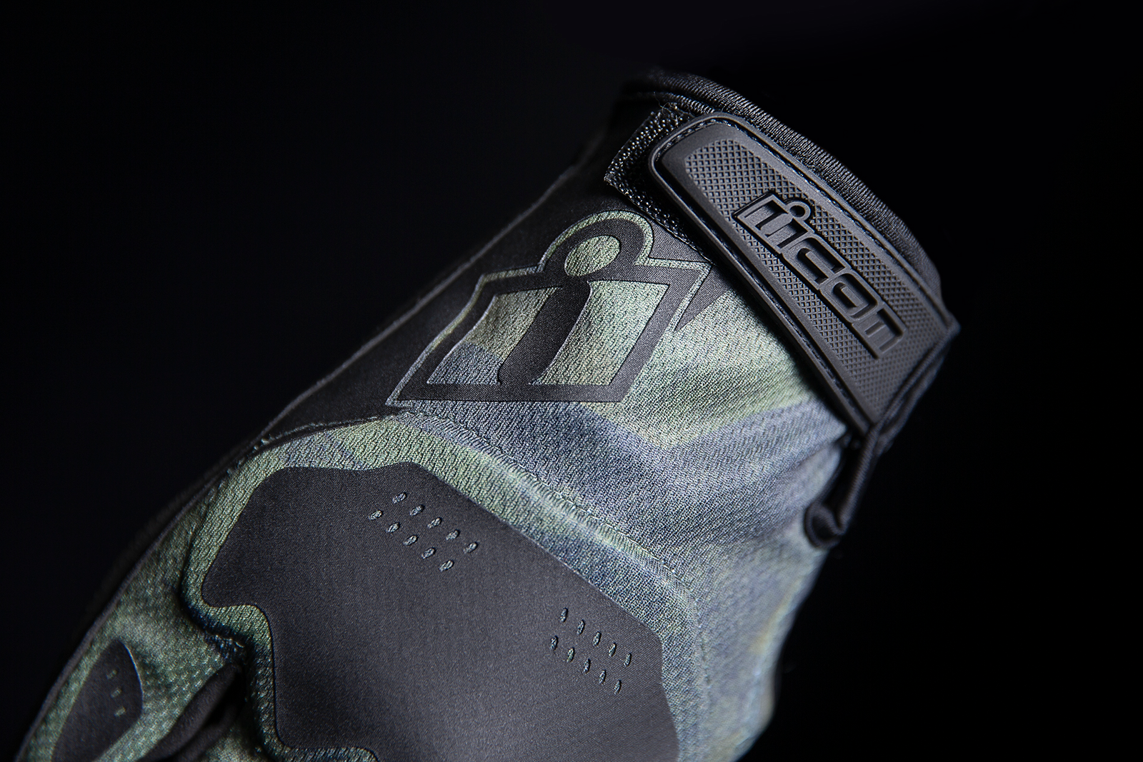 Open box green ICON Hooligan™ Battlescar motorcycle gloves by Bill's Exhausts, medium size, with rugged design and protective features.