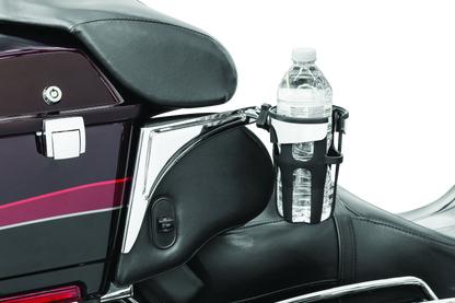 Chrome Kuryakyn Reflex Drink Holder for Harley-Davidson Touring motorcycles, securely mounted with sleek finish.