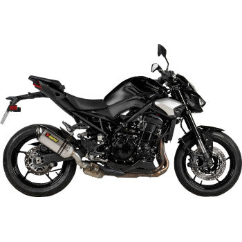 A Kawasaki Z900 2025 motorcycle with an in-stock Akrapovic slip-on titanium exhaust muffler, showing the sleek, polished titanium finish.